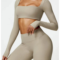 Women's long sleeve fitness T-shirt by MANDOTOS INTERNATIONAL, gym push-up top, designed for active wear and support.