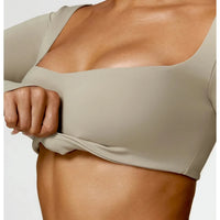 Women's long sleeve fitness T-shirt by MANDOTOS INTERNATIONAL, gym push-up top, made for active workouts and comfortable fit.