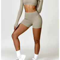Women's long sleeve fitness T-shirt by MANDOTOS INTERNATIONAL, gym workout top with push-up design, versatile activewear for women.
