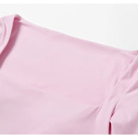 Women's long sleeve fitness T-shirt by MANDOTOS INTERNATIONAL, gym-ready push-up top with a comfortable fit and stylish design.