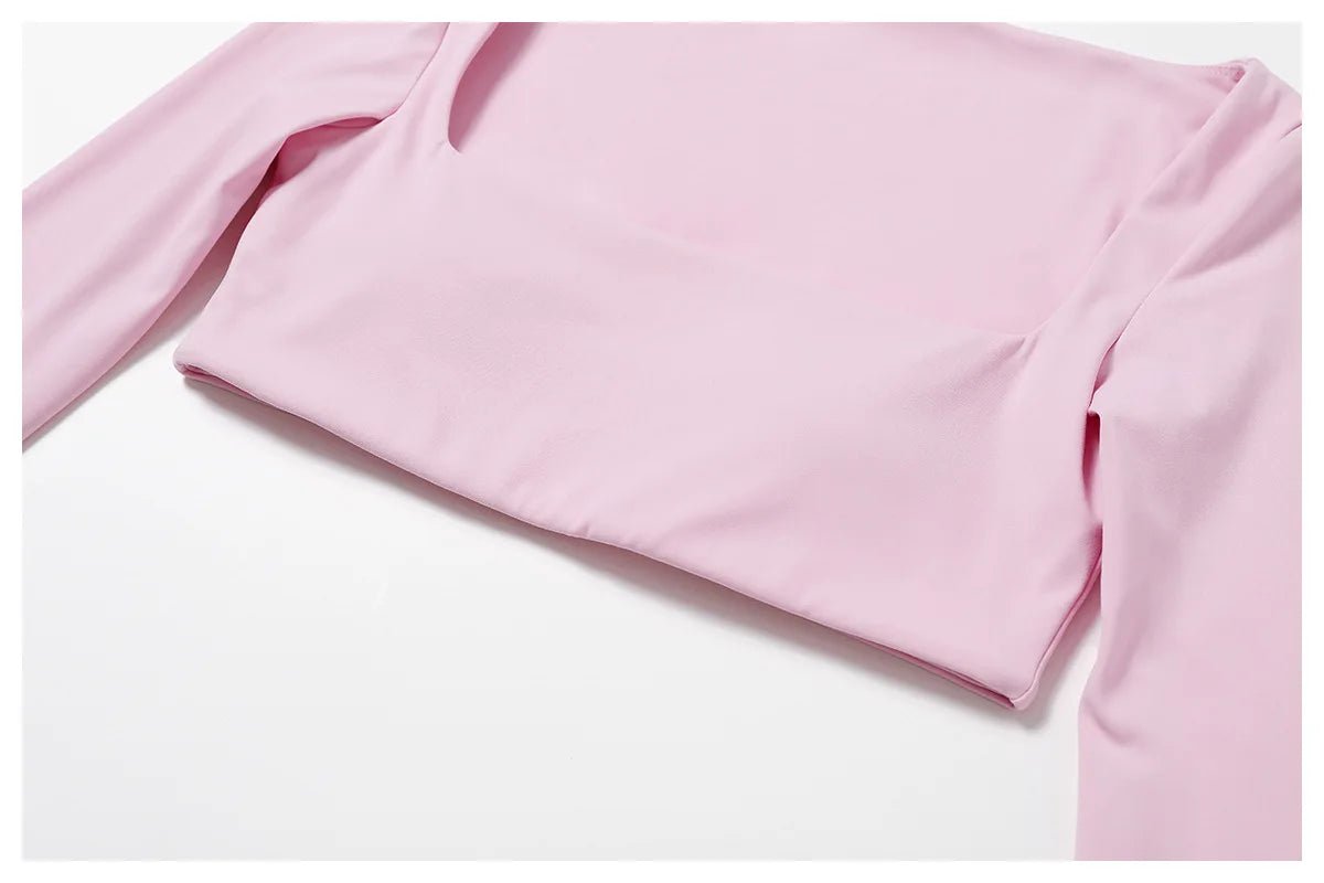 Women's long sleeve fitness T-shirt by MANDOTOS INTERNATIONAL, gym push-up top, made for active workouts and comfortable movement.
