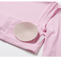 Women's long sleeve fitness T-shirt by MANDOTOS INTERNATIONAL, gym push-up top, made for active wear and comfortable workouts.
