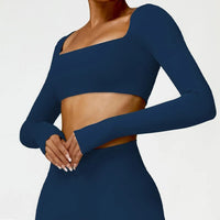 Women's long sleeve fitness T-shirt by MANDOTOS INTERNATIONAL, gym push-up top, designed for active wear and support.