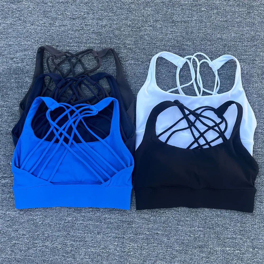Women's shockproof yoga crop top and anti-sweat gym sports bra by MANDOTOS INTERNATIONAL, shown on a model, designed for active workouts.