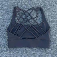 Mandotos International women's shockproof yoga crop top with anti-sweat fabric, designed for gym and sports activities.