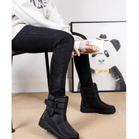 Women's waterproof winter snow boots by MANDOTOS INTERNATIONAL with non-slip soles, warm insulation, and a stylish platform design.