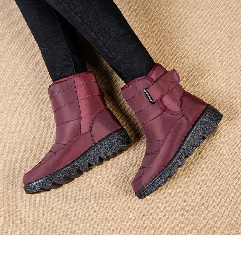 Women's waterproof winter snow boots by MANDOTOS INTERNATIONAL, non-slip ankle boots with warm platform soles, ideal for cold weather.