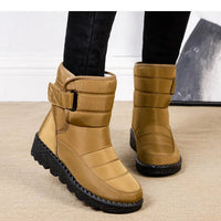 Women's waterproof winter snow boots by MANDOTOS INTERNATIONAL with non-slip soles and warm platform design, ankle-height style.