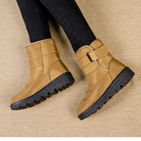 Women's waterproof winter snow boots by MANDOTOS INTERNATIONAL with non-slip soles, warm lining, and platform heel, ankle height.