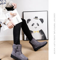Women's waterproof winter snow boots by MANDOTOS INTERNATIONAL with non-slip soles and warm platform design, ankle height, stylish and functional.