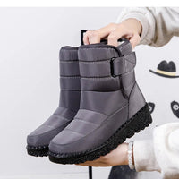 Women's waterproof winter snow boots by MANDOTOS INTERNATIONAL with non-slip soles and warm platform design.
