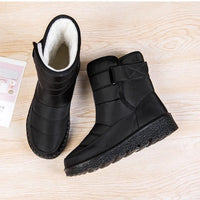 Women's waterproof winter snow boots by MANDOTOS INTERNATIONAL with non-slip soles, warm lining, and platform design.