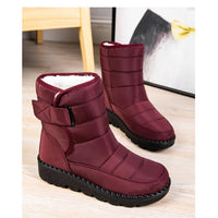 Women's waterproof winter snow boots by MANDOTOS INTERNATIONAL with non-slip soles, warm lining, ankle height, and platform design.