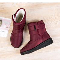 Women's waterproof winter snow boots by MANDOTOS INTERNATIONAL with non-slip soles, warm lining, and platform heel, ankle height.
