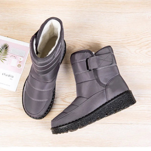 Women's waterproof winter snow boots by MANDOTOS INTERNATIONAL featuring non-slip soles, ankle height, warm lining, and platform style.