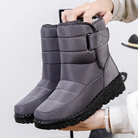 Women's waterproof winter snow boots by MANDOTOS INTERNATIONAL with non-slip soles and warm platform design.