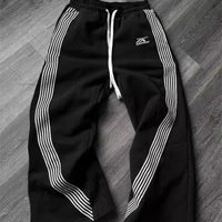 Y2k embroidered black and gray camouflage tactical jogger pants by MANDOTOS INTERNATIONAL, with drawstring waist and functional design.