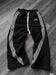 Y2k embroidered black and gray camouflage tactical jogger pants by MANDOTOS INTERNATIONAL, with drawstring waist and functional design.