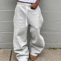 Y2K embroidered black and gray casual tactical jogger pants with camo pattern, drawstring waist, for men and women by MANDOTOS INTERNATIONAL.