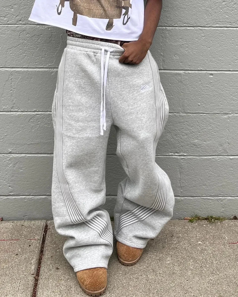 Y2K embroidered black and gray casual tactical jogger pants with camo pattern, drawstring waist, for men and women by MANDOTOS INTERNATIONAL.