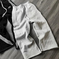 Y2K embroidered black and gray casual camo jogger pants with drawstring waistband, tactical style, for men and women by MANDOTOS INTERNATIONAL.