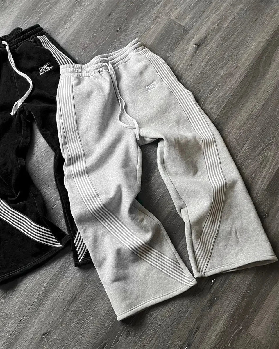 Y2K embroidered black and gray casual camo jogger pants with drawstring waistband, tactical style, for men and women by MANDOTOS INTERNATIONAL.