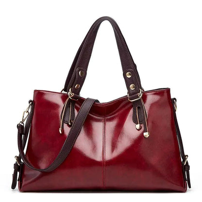 Mandotos Kathie leather tote purse with spacious interior, sturdy handles, and sleek design in rich brown leather.