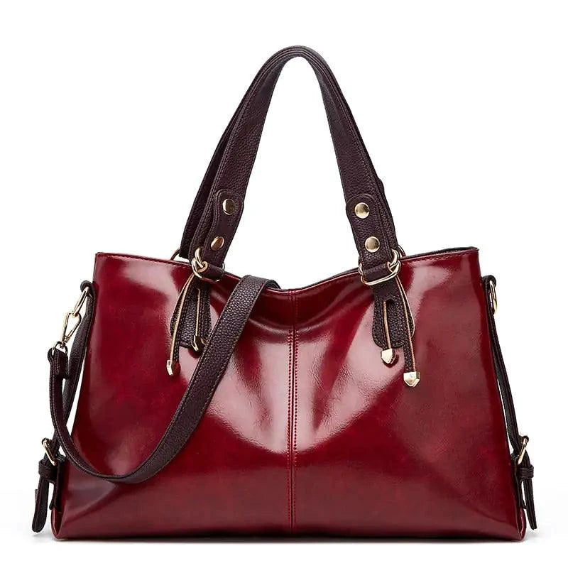 Mandotos Kathie leather tote purse with spacious interior, sturdy handles, and elegant design in rich brown leather.