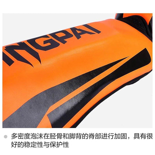 Mandotos kickboxing shin guards and Muay Thai leg protectors shown in black with adjustable straps for secure fit.
