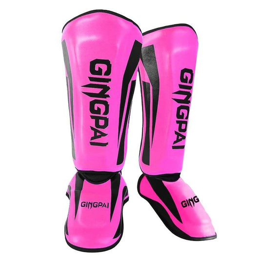 Mandotos kickboxing shin guards and Muay Thai leg protectors, padded for impact protection during training or matches.