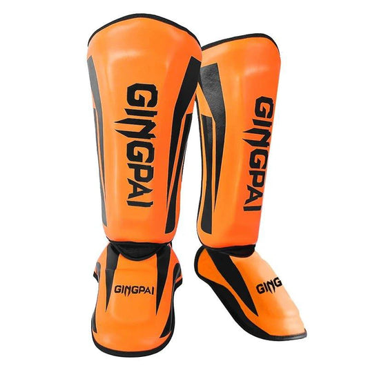 Mandotos kickboxing shin guards and Muay Thai leg protectors with padded design for impact protection during training.