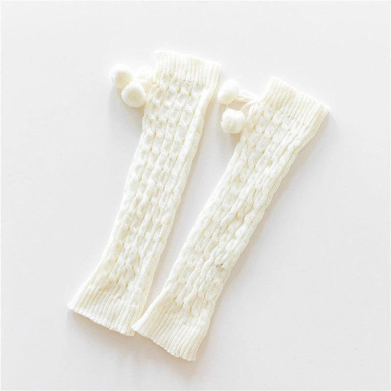 Mandotos knitted wool daytime leggings and knee-high socks, soft and warm for cozy winter wear, shown in natural beige color.