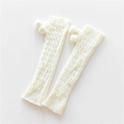 Mandotos knitted wool daytime leggings and knee-high socks, soft and warm for cozy winter wear, shown in natural beige color.