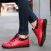 Mandotos Korean student shoes featuring black canvas with white rubber soles and lace-up design for casual wear.