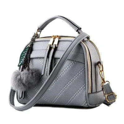 Elegant ladies' luxury leather handbag by MANDOTOS with sleek design and high-quality leather detail.