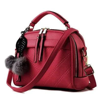 Elegant ladies' luxury leather handbag by MANDOTOS featuring a sleek design and polished finish.