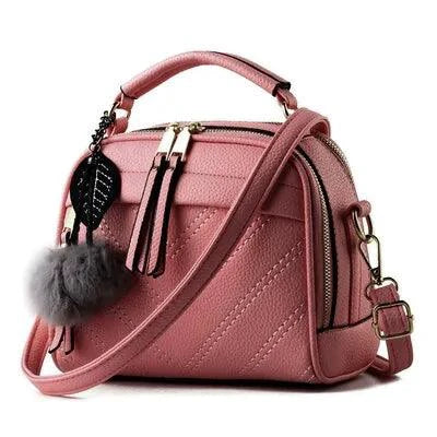 Elegant ladies' luxury leather handbag by MANDOTOS with sleek design, top handle, and refined craftsmanship.