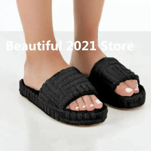 Comfortable ladies' plush slip-on slippers by MANDOTOS with soft, cozy fabric for indoor wear.
