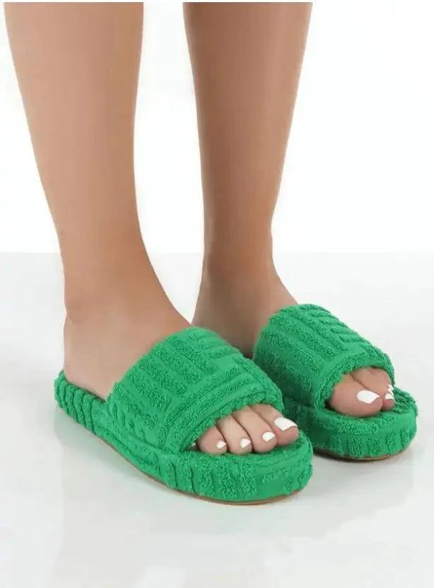 Comfortable ladies' plush slip-on slippers by MANDOTOS, featuring soft material and cozy design for indoor wear.