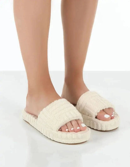 Mandotos ladies' plush slip-on slippers with soft, cozy fabric and cushioned soles for comfortable indoor wear.