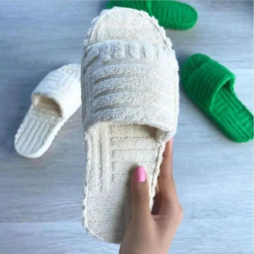 Comfortable ladies' plush slip-on slippers by MANDOTOS with soft, cozy fabric and cushioned soles for indoor wear.