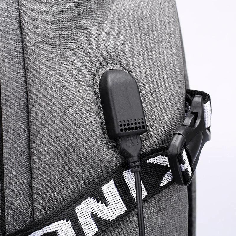 Mandotos laptop backpack with USB charging port, black, featuring padded compartments and adjustable straps for travel and daily use.