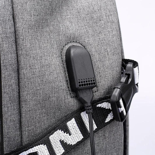 Mandotos laptop backpack with USB charging port, black, featuring padded compartments and adjustable straps for travel and daily use.
