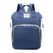 Large-capacity Mommy Bag by MANDOTOS with multiple compartments and adjustable straps, designed for moms to carry essentials comfortably.