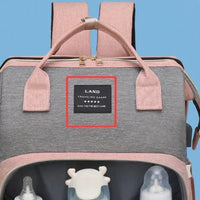 Large-capacity Mommy Bag by MANDOTOS with multiple compartments, durable fabric, and ergonomic handles for busy moms.