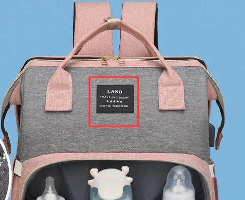 Large-capacity Mommy Bag by MANDOTOS with multiple compartments, durable fabric, and ergonomic handles for busy moms.