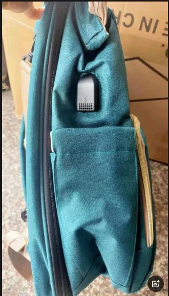 Large-capacity Mommy Bag by MANDOTOS, showing spacious interior with multiple compartments and sturdy straps for moms.