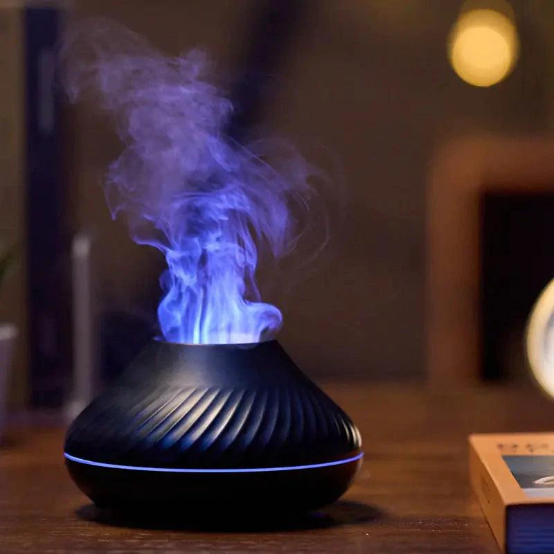 Mandotos Lava Glow essential oil nebulizer emitting a soft, colorful glow with mist, compact design for aromatherapy use