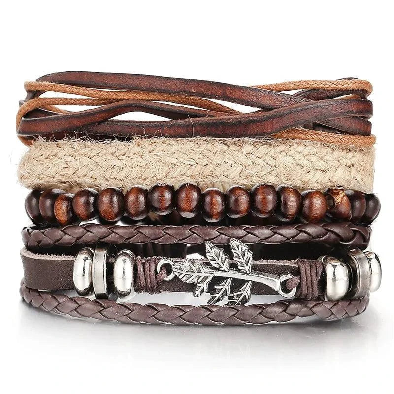 Layered leather charm bracelet by MANDOTOS featuring multiple leather strands and metal charms on a neutral background.