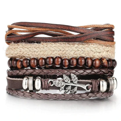 Layered leather charm bracelet by MANDOTOS featuring multiple leather strands and metal charms on a neutral background.